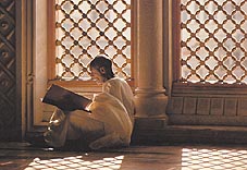 Pèlerins lisant le Saint Coran Click to view high resolution version